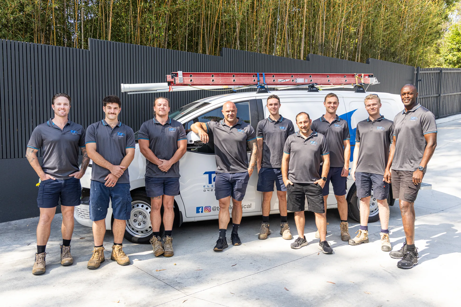 The Family Electrician Maudsland team with a service van